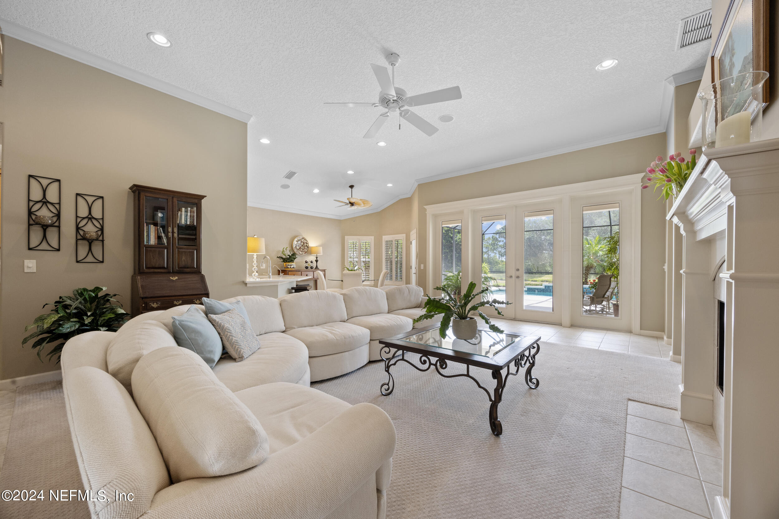 348 Fiddlers Point Drive St. Augustine, FL 32080 - Photo 5 of 58 a living room with furniture and a chandelier