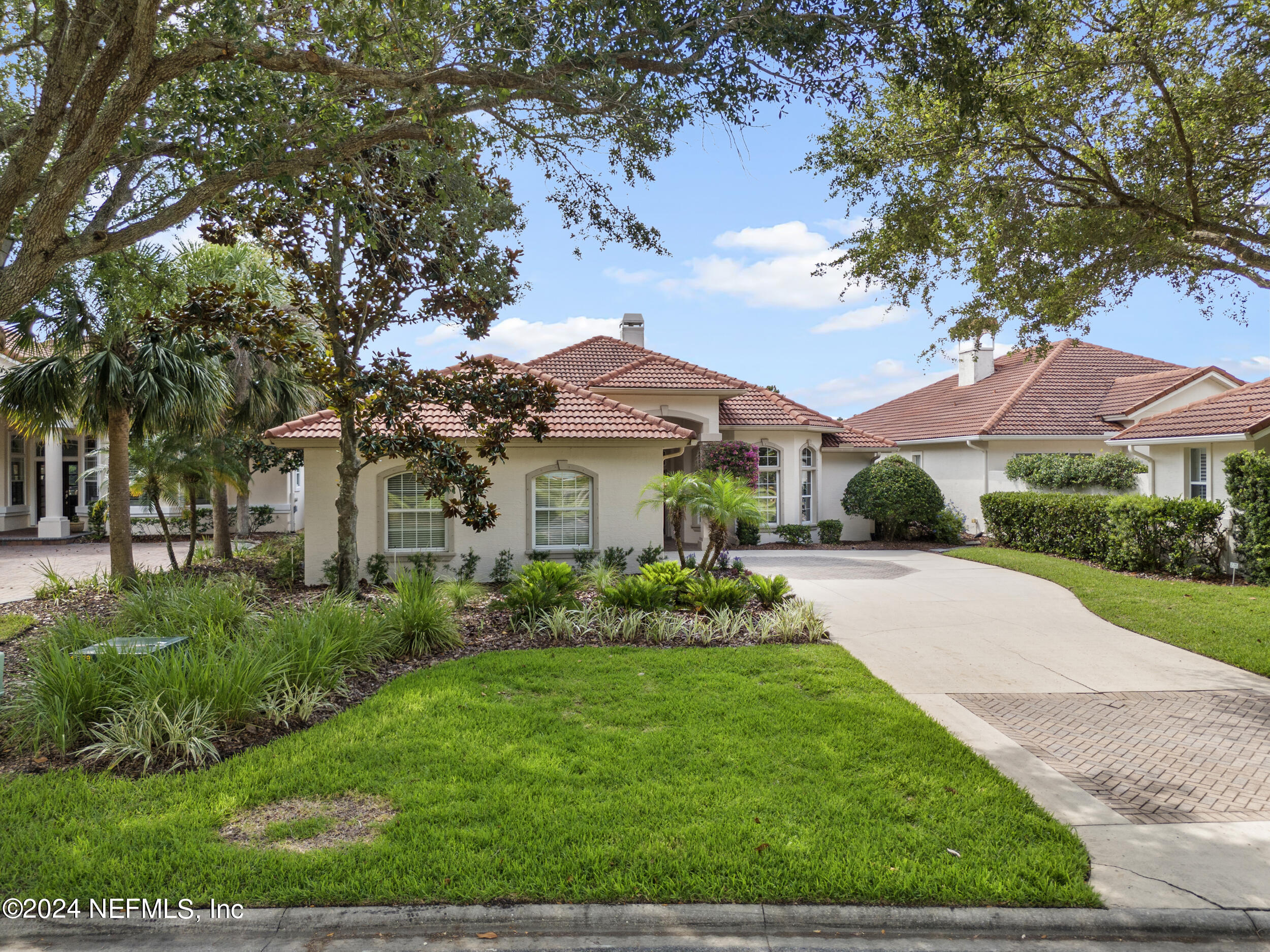 348 Fiddlers Point Drive St. Augustine, FL 32080 - Photo 51 of 58 a front view of a house with a yard