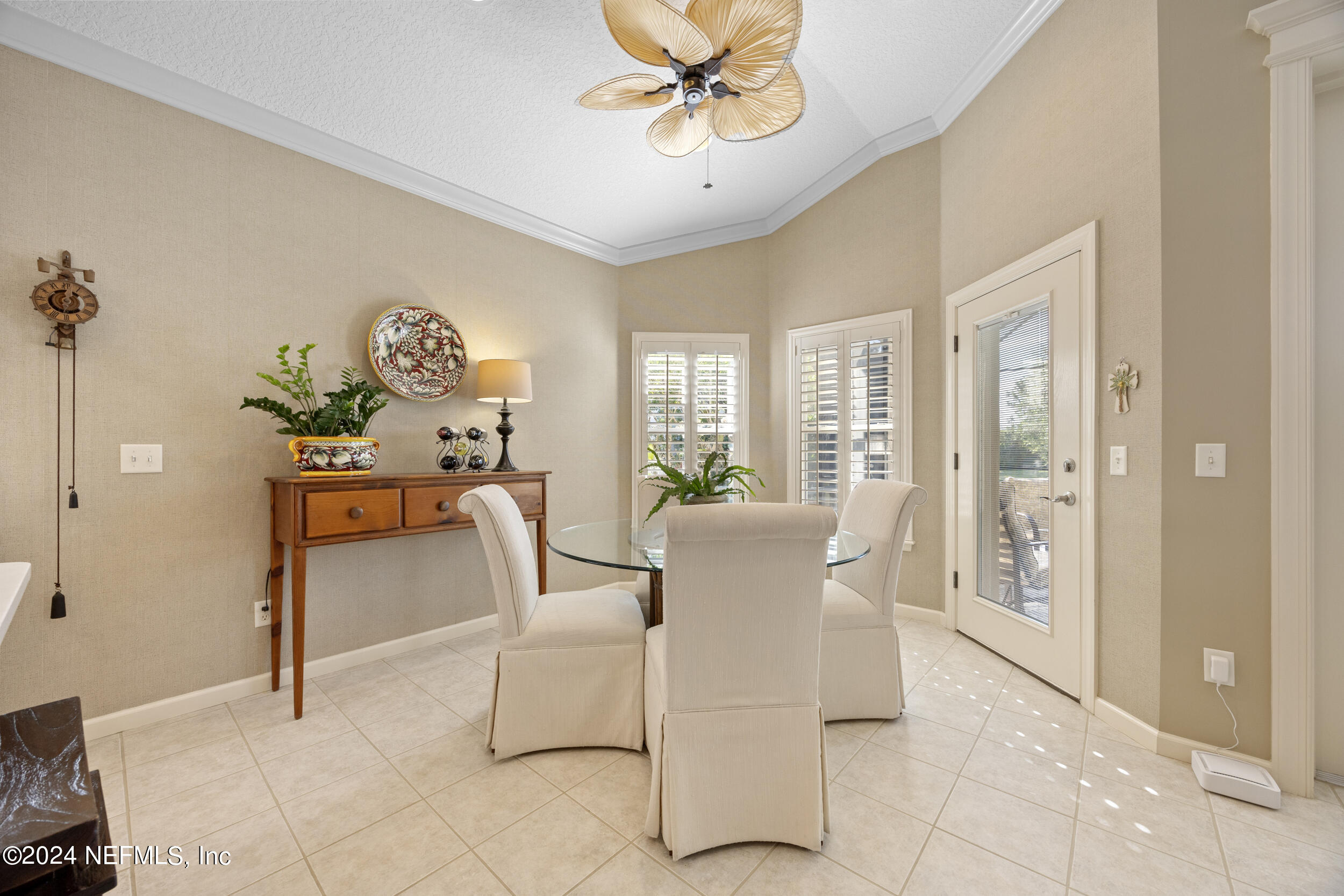 348 Fiddlers Point Drive St. Augustine, FL 32080 - Photo 9 of 58 a living room with furniture and a table