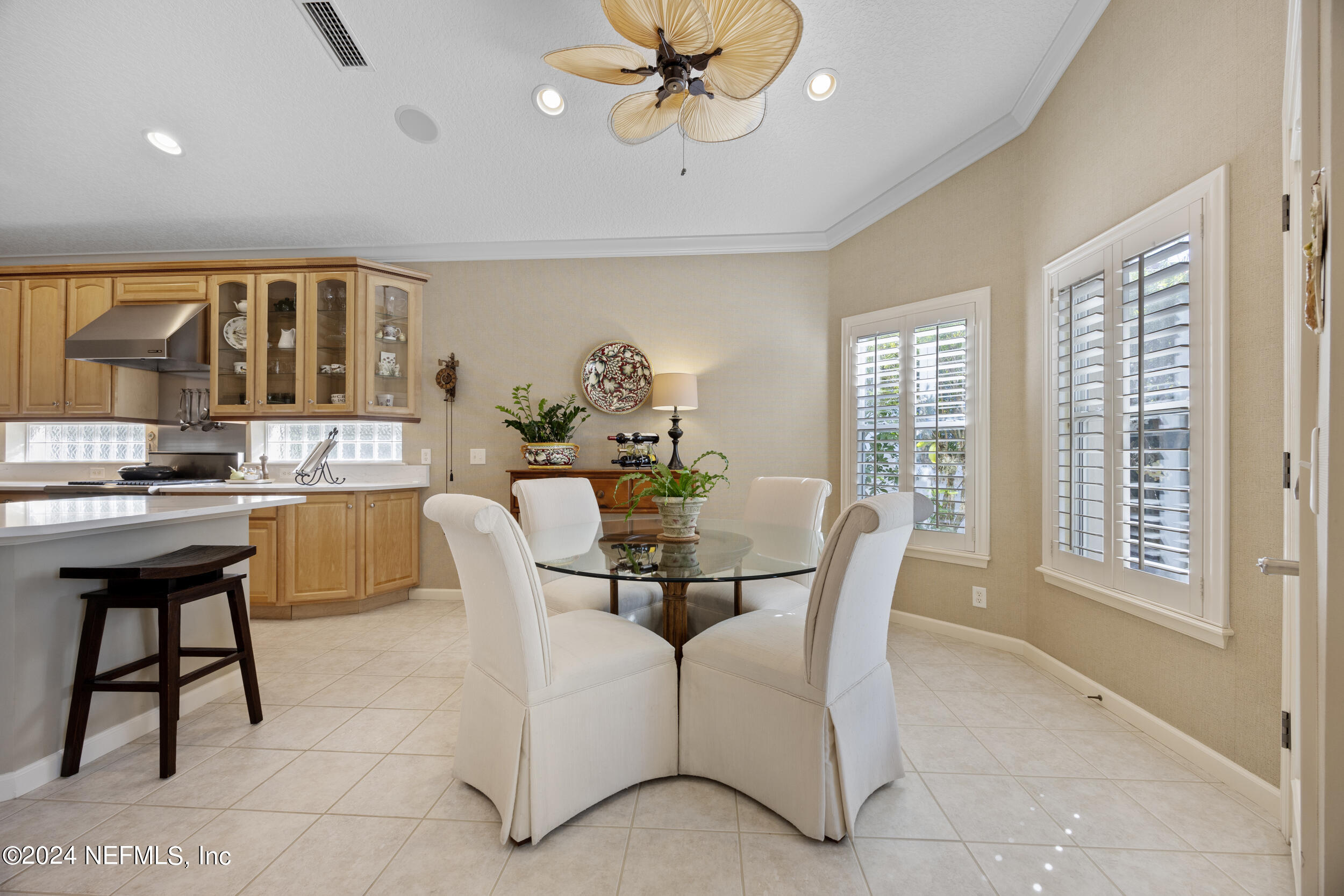 348 Fiddlers Point Drive St. Augustine, FL 32080 - Photo 10 of 58 a dining room with furniture and window