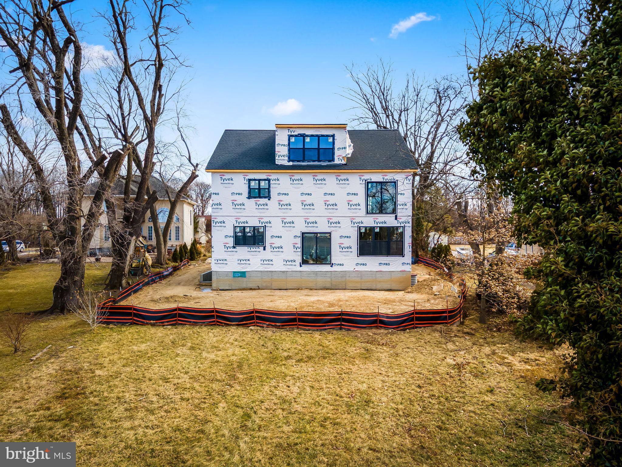 1158 East Riverside Avenue Essex, MD 21221 - Photo 11 of 15 a front view of a house with a yard