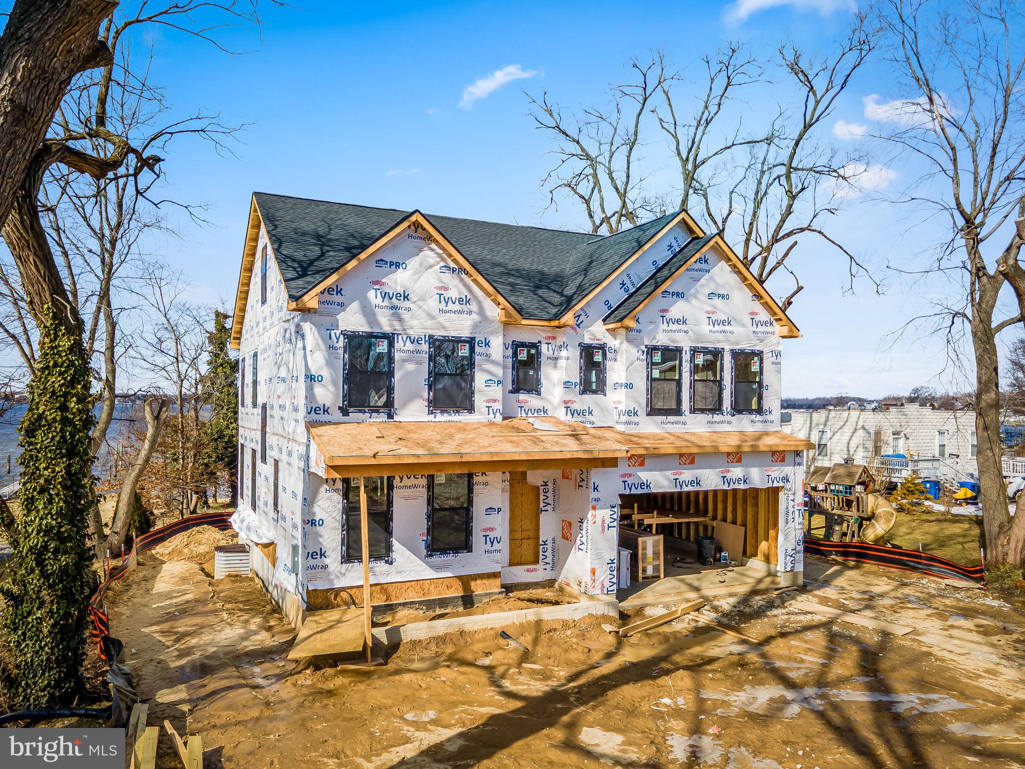 1158 East Riverside Avenue Essex, MD 21221 - Photo 2 of 15 a front view of a house with garden