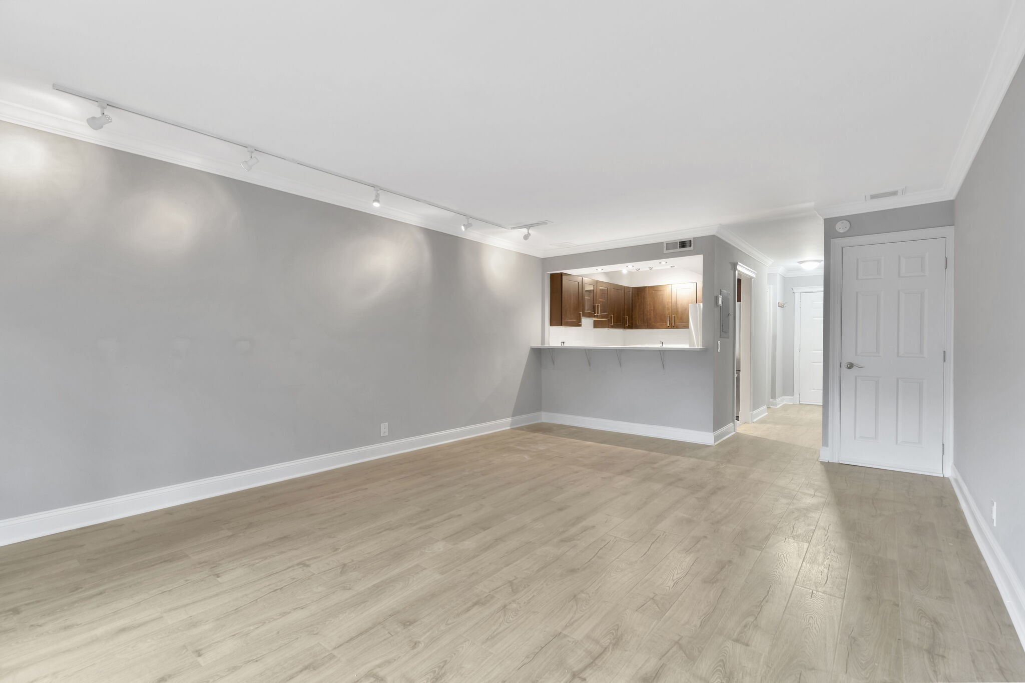 2116 Hobbs Road, Unit A7 Nashville, TN 37215 - Photo 6 of 12 a view of an empty room with wooden floor and a window