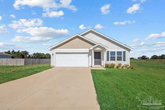 a front view of a house with yard