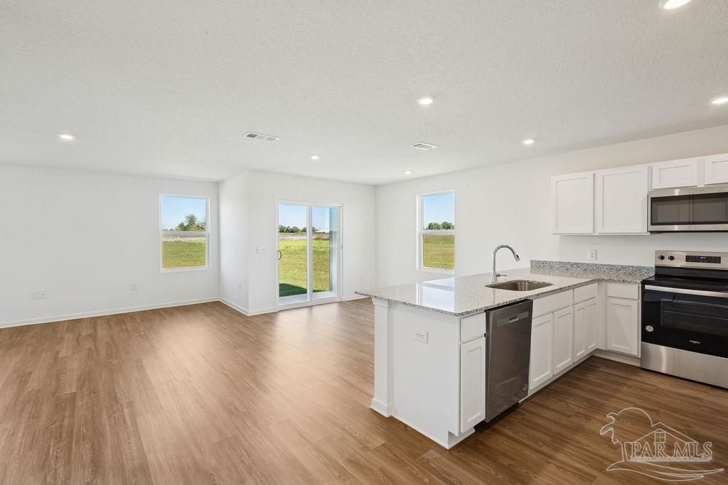 3422 Shell Road Jay, FL 32565 - Photo 17 of 31 a kitchen with stove and cabinets