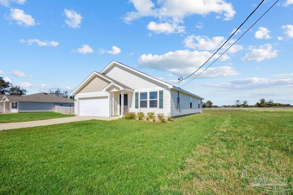 3422 Shell Road Jay, FL 32565 - Photo 2 of 31 a view of a house with backyard and garden