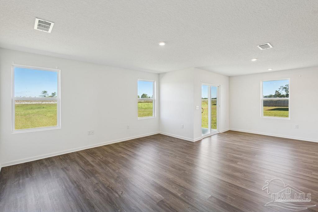 3422 Shell Road Jay, FL 32565 - Photo 22 of 31 a view of an empty room with wooden floor and a window
