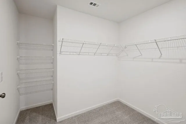 a view of a room with racks on the wall