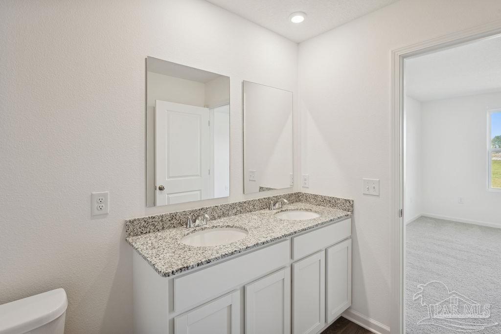 3422 Shell Road Jay, FL 32565 - Photo 29 of 31 a bathroom with a granite countertop sink and a mirror