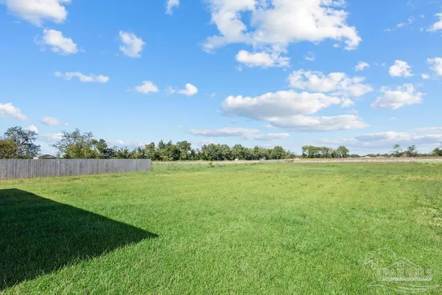 a view of an ocean and a yard