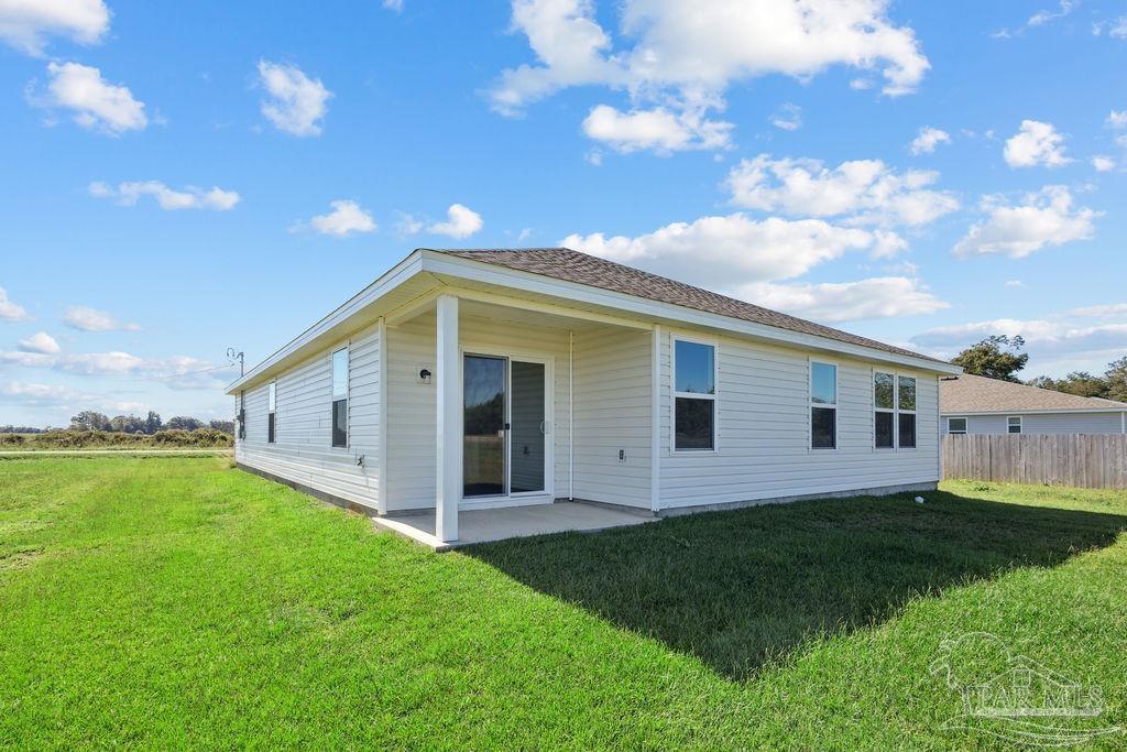 3422 Shell Road Jay, FL 32565 - Photo 5 of 31 a view of a house with backyard and garden