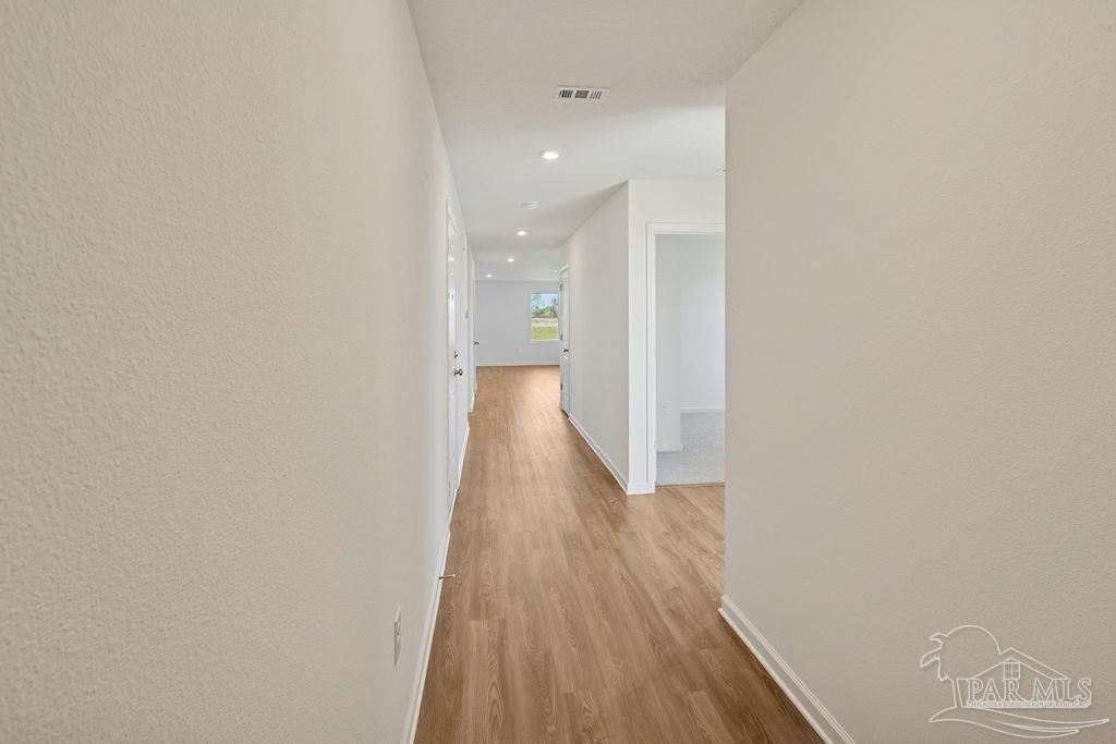 3422 Shell Road Jay, FL 32565 - Photo 6 of 31 a view of a hallway with wooden floor