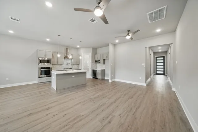 a view of kitchen with wooden floor and window