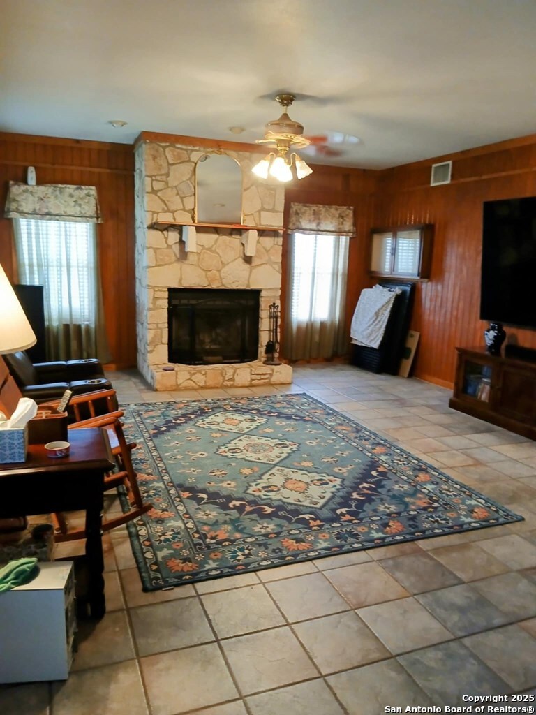 1121 Colony Road Beeville, TX 78102 - Photo 12 of 19 a living room with furniture a flat screen tv and a fireplace