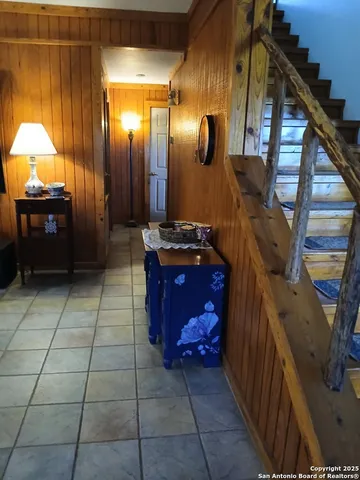 a kitchen with kitchen island a stove top oven a sink and a refrigerator