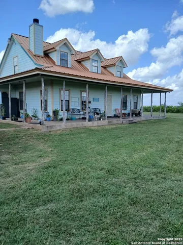 a view of a large house with many windows and a table