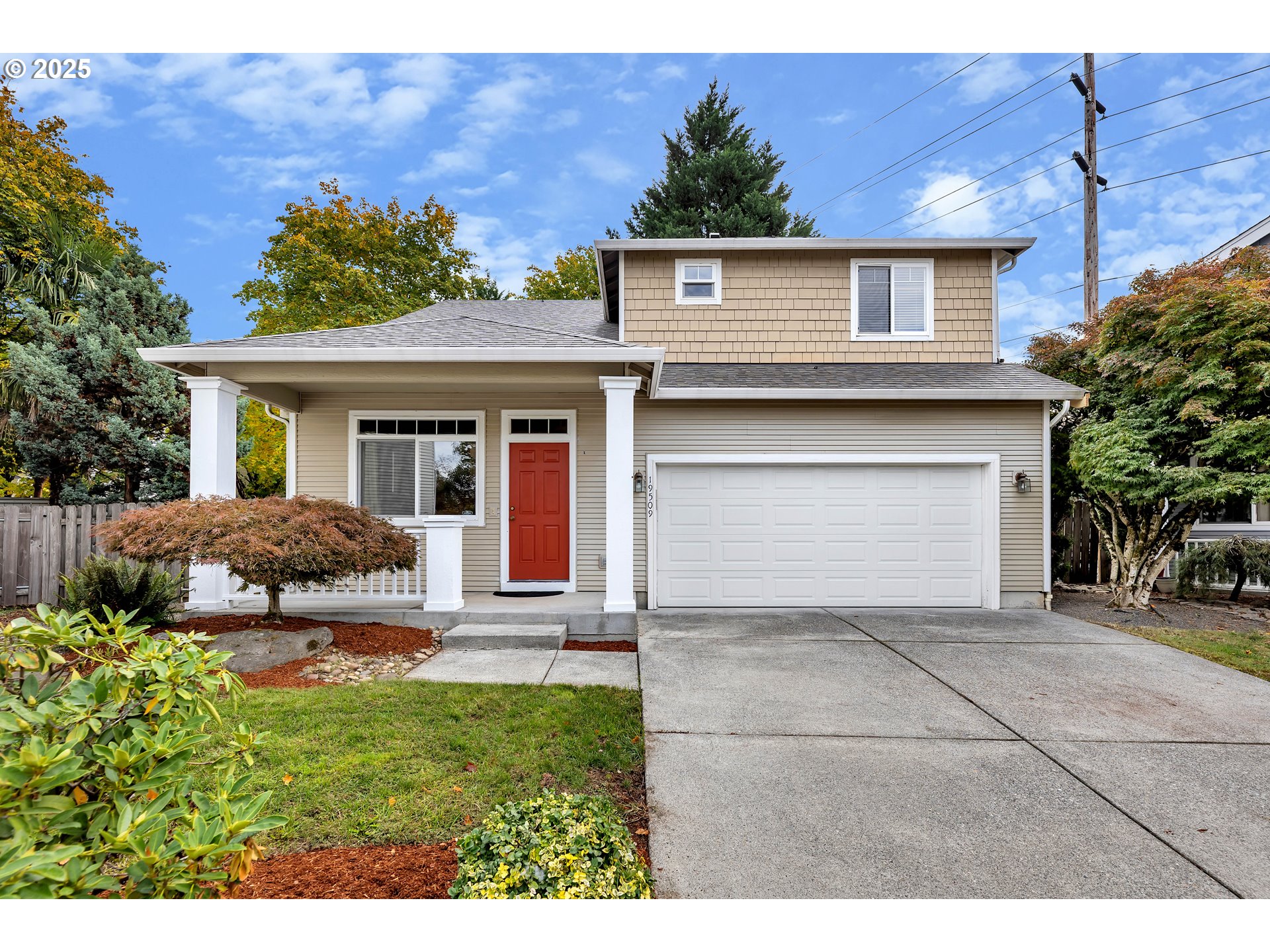 19509 Southeast 33rd Street Camas, WA 98607 - Photo 1 of 37 a view of a house with a yard and a garage