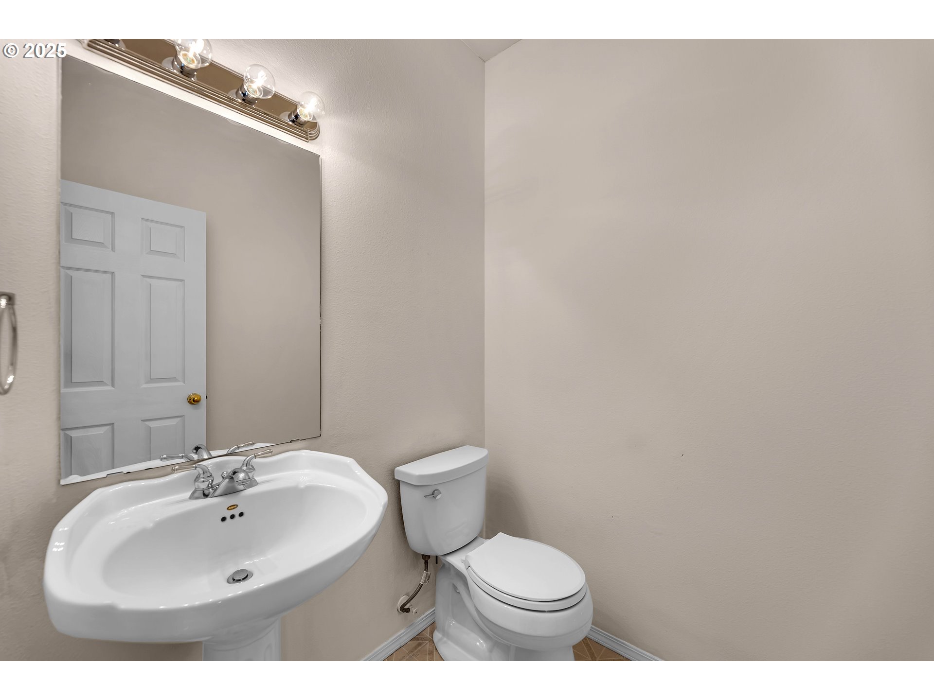 19509 Southeast 33rd Street Camas, WA 98607 - Photo 32 of 37 a bathroom with a sink a toilet and mirror