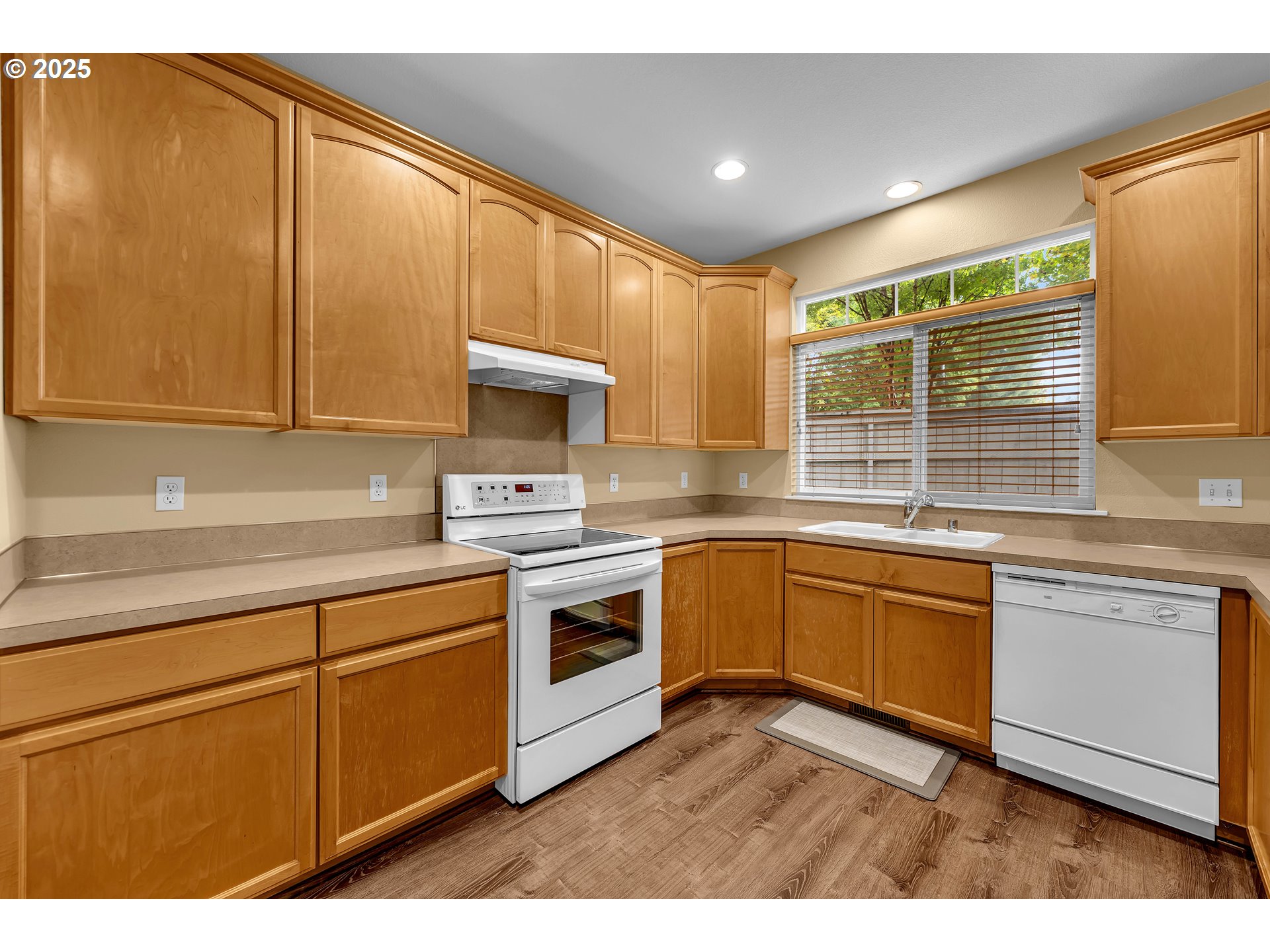 19509 Southeast 33rd Street Camas, WA 98607 - Photo 9 of 37 a kitchen with stainless steel appliances granite countertop a stove a sink and a microwave
