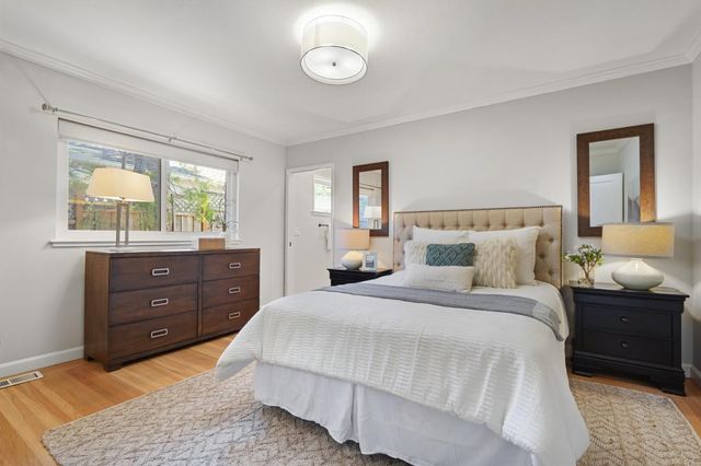 a bedroom with a bed and window