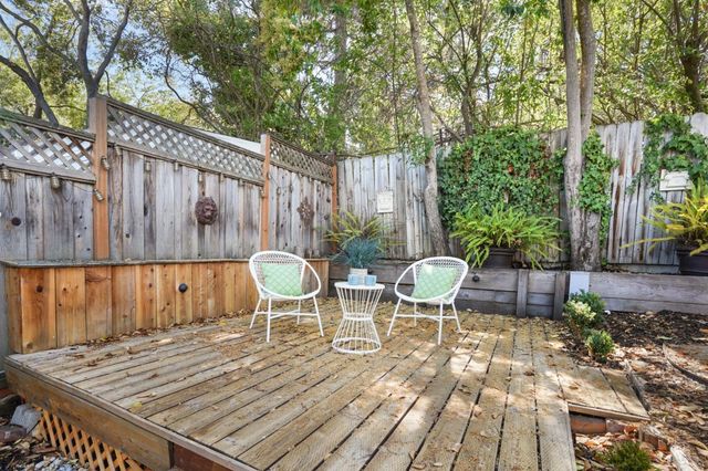 a view of a chairs and table in backyard