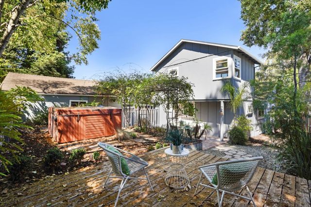 a view of a patio with a table and chairs
