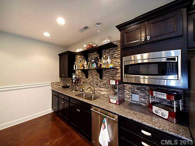 803 Harvest Pointe Drive Fort Mill, SC 29708 - Photo 11 of 16 a kitchen with stainless steel appliances and cabinets