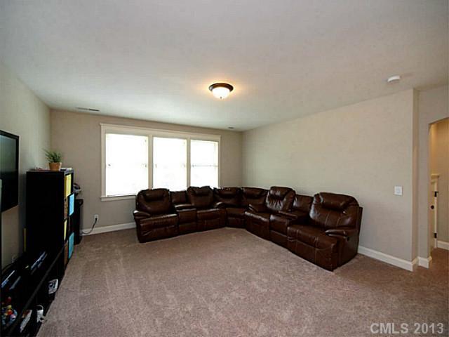 803 Harvest Pointe Drive Fort Mill, SC 29708 - Photo 13 of 16 a living room with furniture window and a flat screen tv