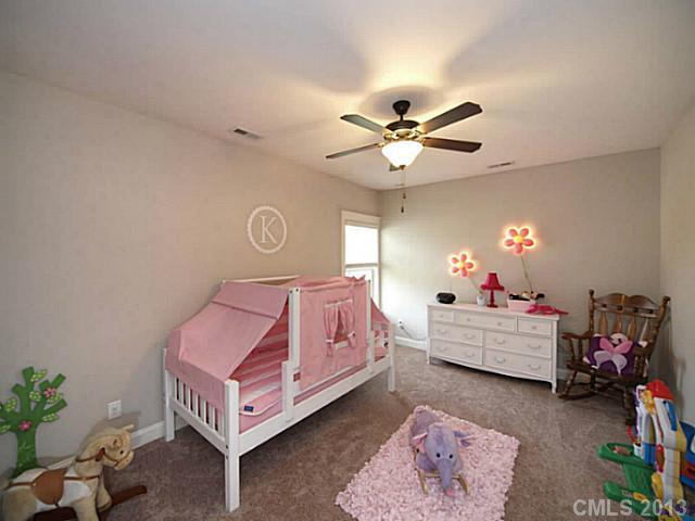 803 Harvest Pointe Drive Fort Mill, SC 29708 - Photo 15 of 16 a living room with furniture and a chandelier