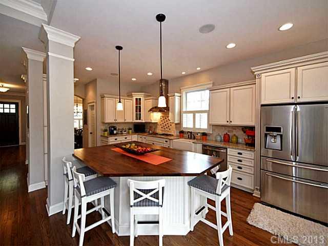 803 Harvest Pointe Drive Fort Mill, SC 29708 - Photo 4 of 16 a kitchen with a table chairs refrigerator and microwave