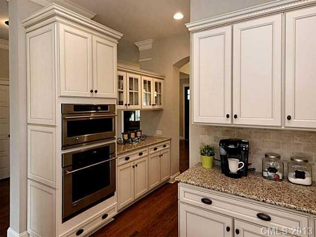803 Harvest Pointe Drive Fort Mill, SC 29708 - Photo 5 of 16 a kitchen with stainless steel appliances granite countertop white cabinets and a stove
