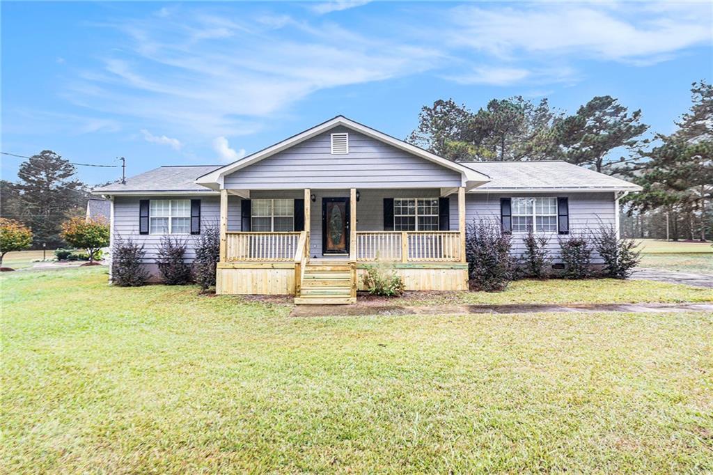 150 Dub Walker Road Jackson, GA 30233 - Photo 1 of 32 a view of a house with pool and a yard
