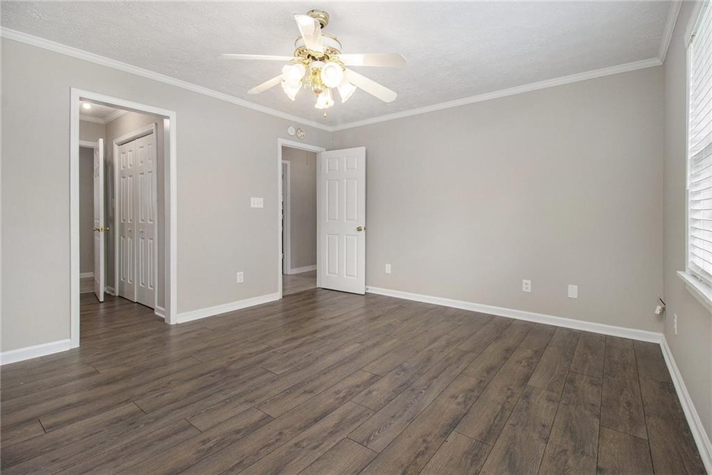 150 Dub Walker Road Jackson, GA 30233 - Photo 18 of 32 a view of an empty room with wooden floor