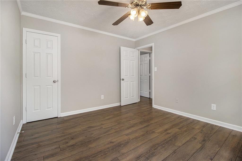 150 Dub Walker Road Jackson, GA 30233 - Photo 20 of 32 a view of an empty room with wooden floor