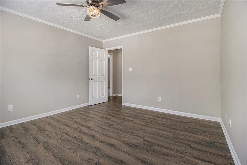 150 Dub Walker Road Jackson, GA 30233 - Photo 21 of 32 a view of an empty room with wooden floor