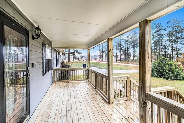 a view of a balcony with wooden floor