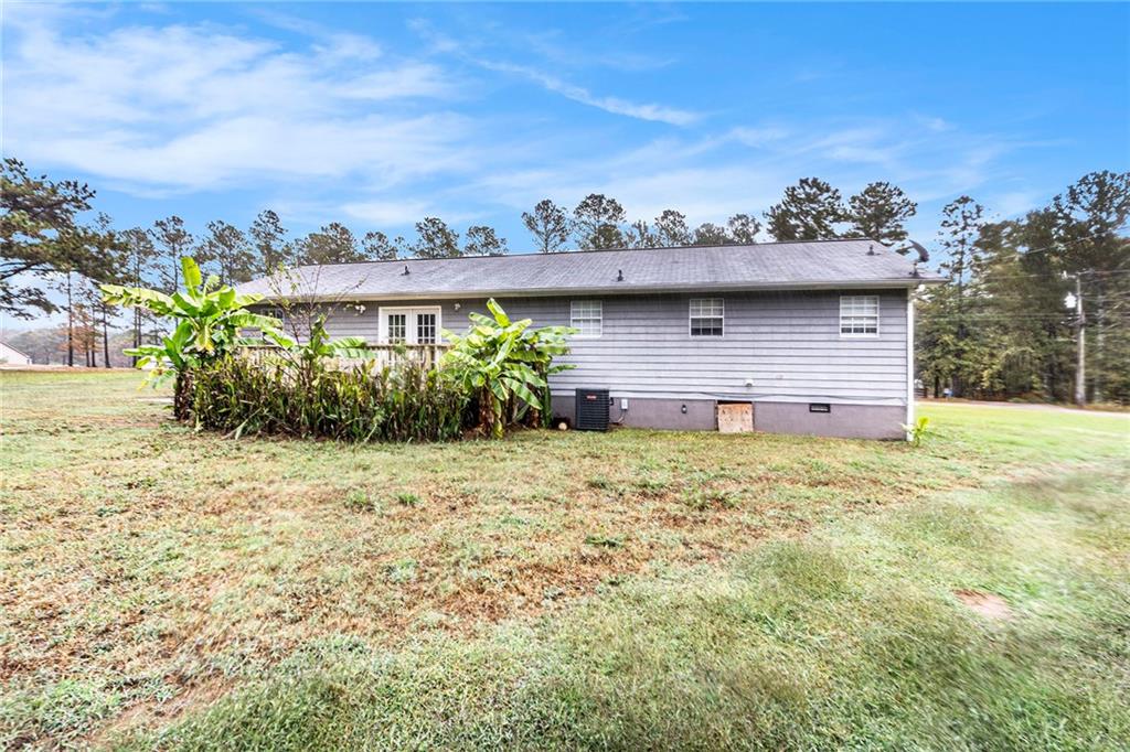 150 Dub Walker Road Jackson, GA 30233 - Photo 31 of 32 a view of a house with a garden