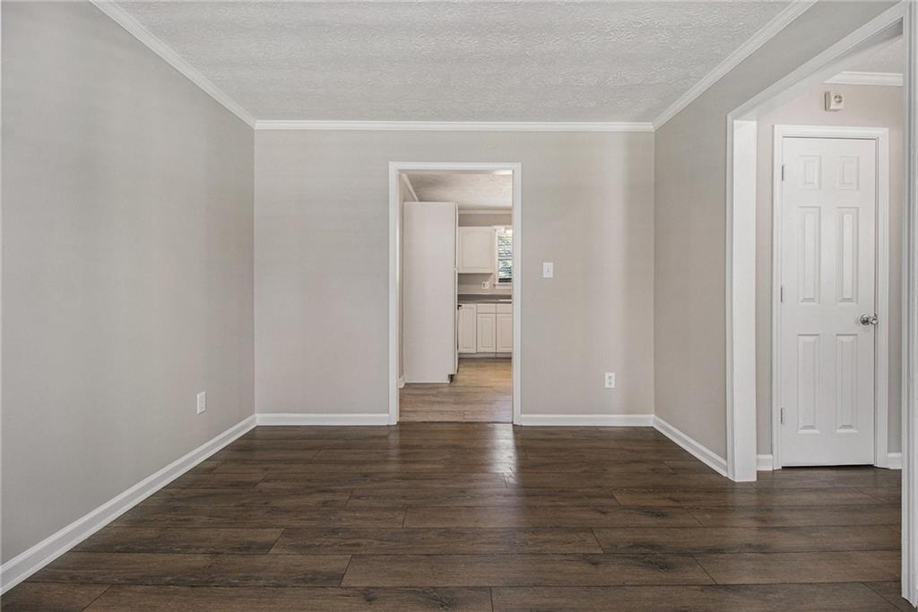 150 Dub Walker Road Jackson, GA 30233 - Photo 10 of 32 a view of an empty room with wooden floor