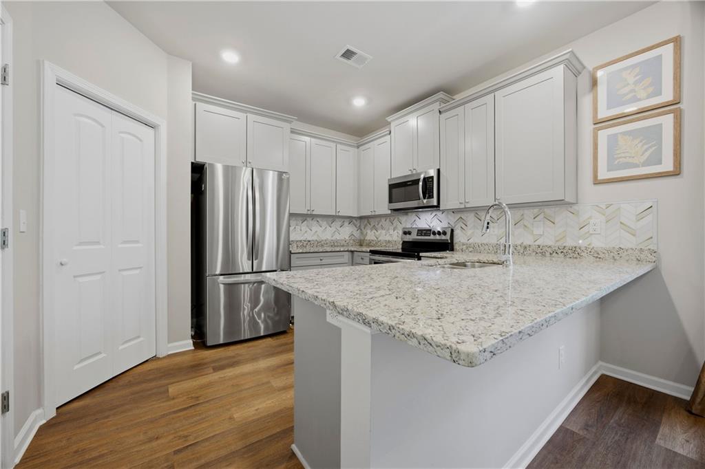 70 Gold Mine Road Grantville, GA 30220 - Photo 7 of 23 a kitchen with stainless steel appliances granite countertop a refrigerator sink and microwave