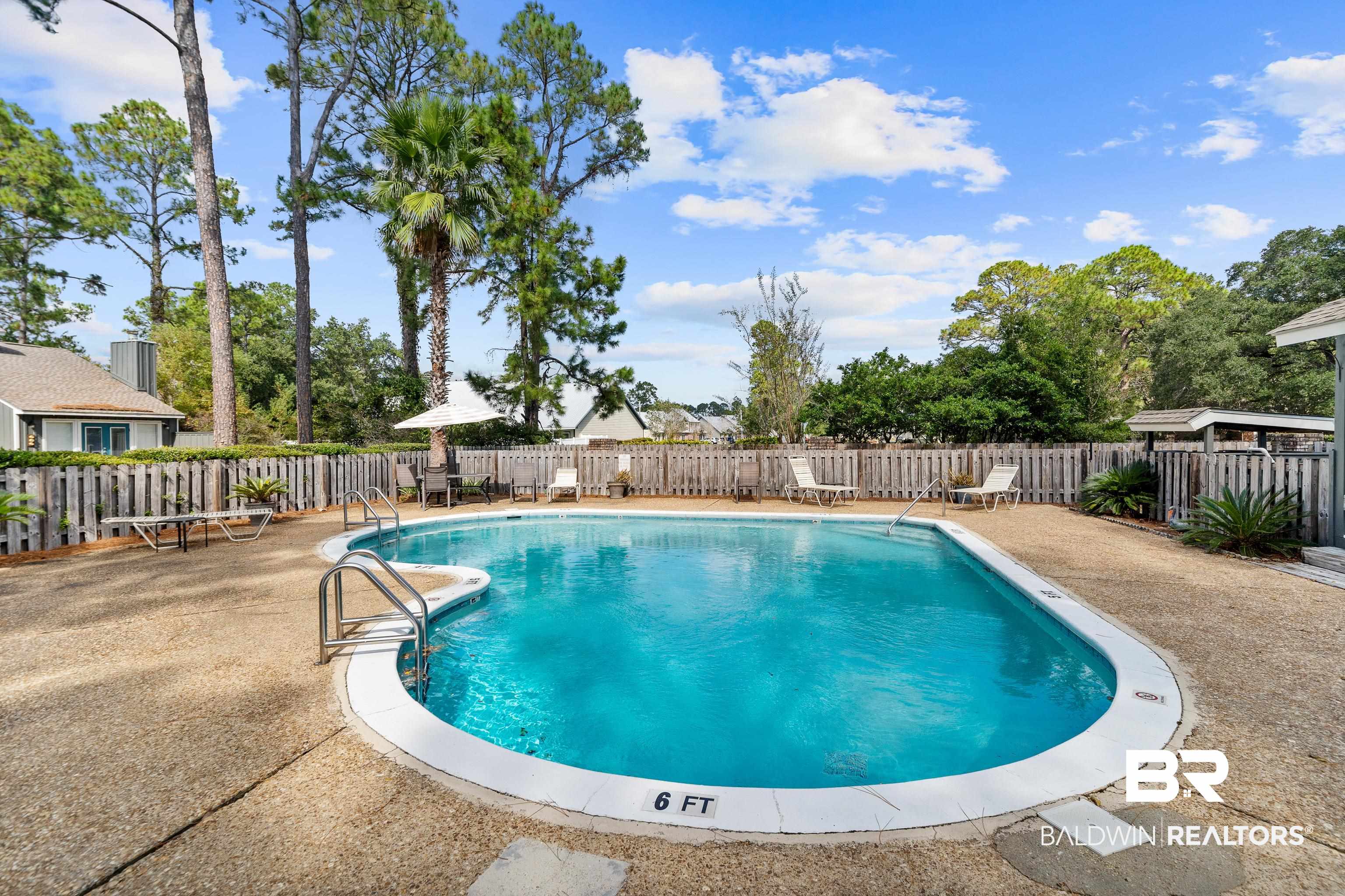 1701 Regency Road, Unit 111 Gulf Shores, AL 36542 - Photo 28 of 29 View of swimming pool featuring a patio
