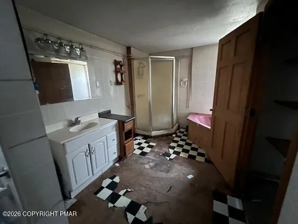 a bathroom with sink and mirror