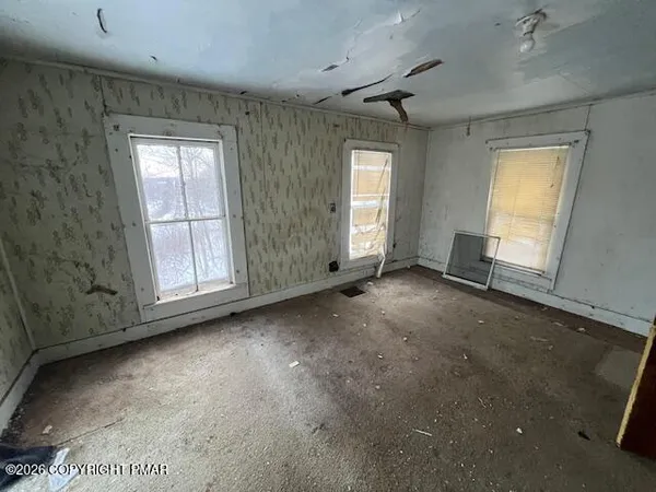 an empty room with windows