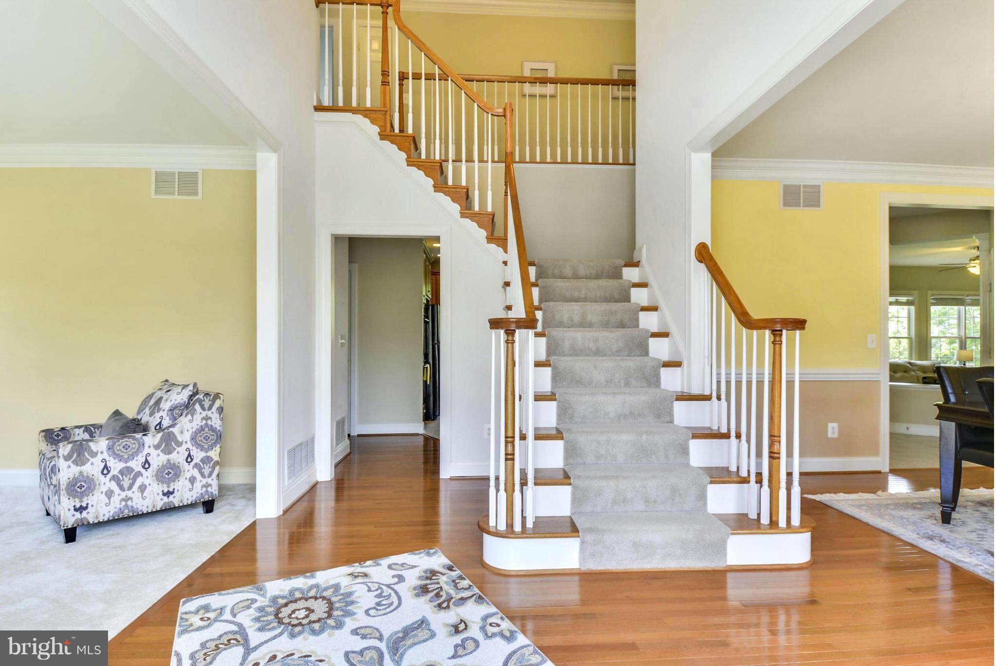 505 Tremont Circle Annapolis, MD 21409 - Photo 11 of 30 a view of a hallway with wooden floor and couches