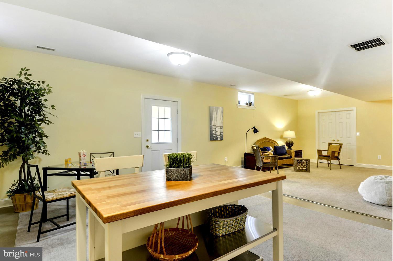505 Tremont Circle Annapolis, MD 21409 - Photo 22 of 30 a view of a kitchen with a table and chairs