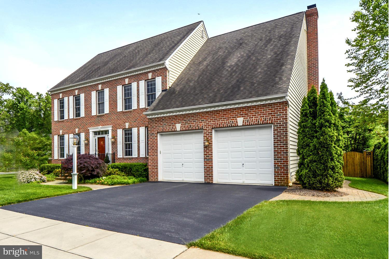 505 Tremont Circle Annapolis, MD 21409 - Photo 8 of 30 a front view of a house with a garden and plants