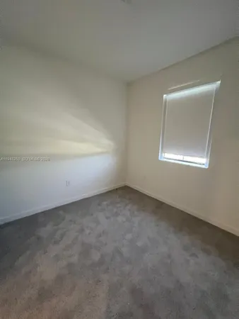 an empty room with closet area