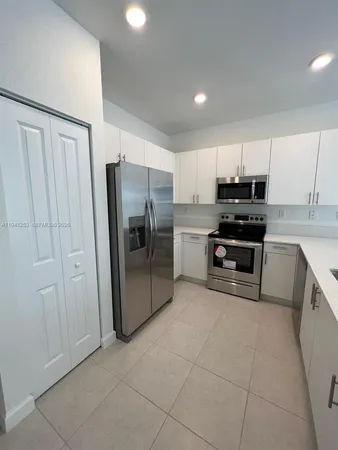 a view of a hallway and closet