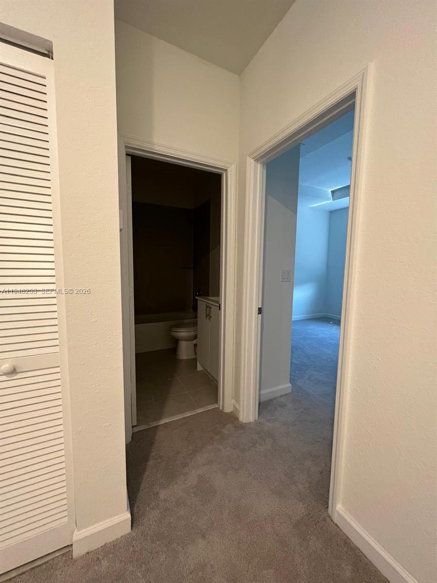 12908 Southwest 233rd Terrace, Unit 12908 Homestead, FL 33032 - Photo 23 of 23 a view of a hallway and closet
