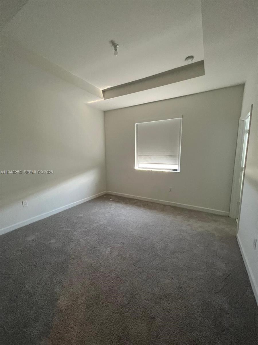 12908 Southwest 233rd Terrace, Unit 12908 Homestead, FL 33032 - Photo 4 of 23 a view of room and window