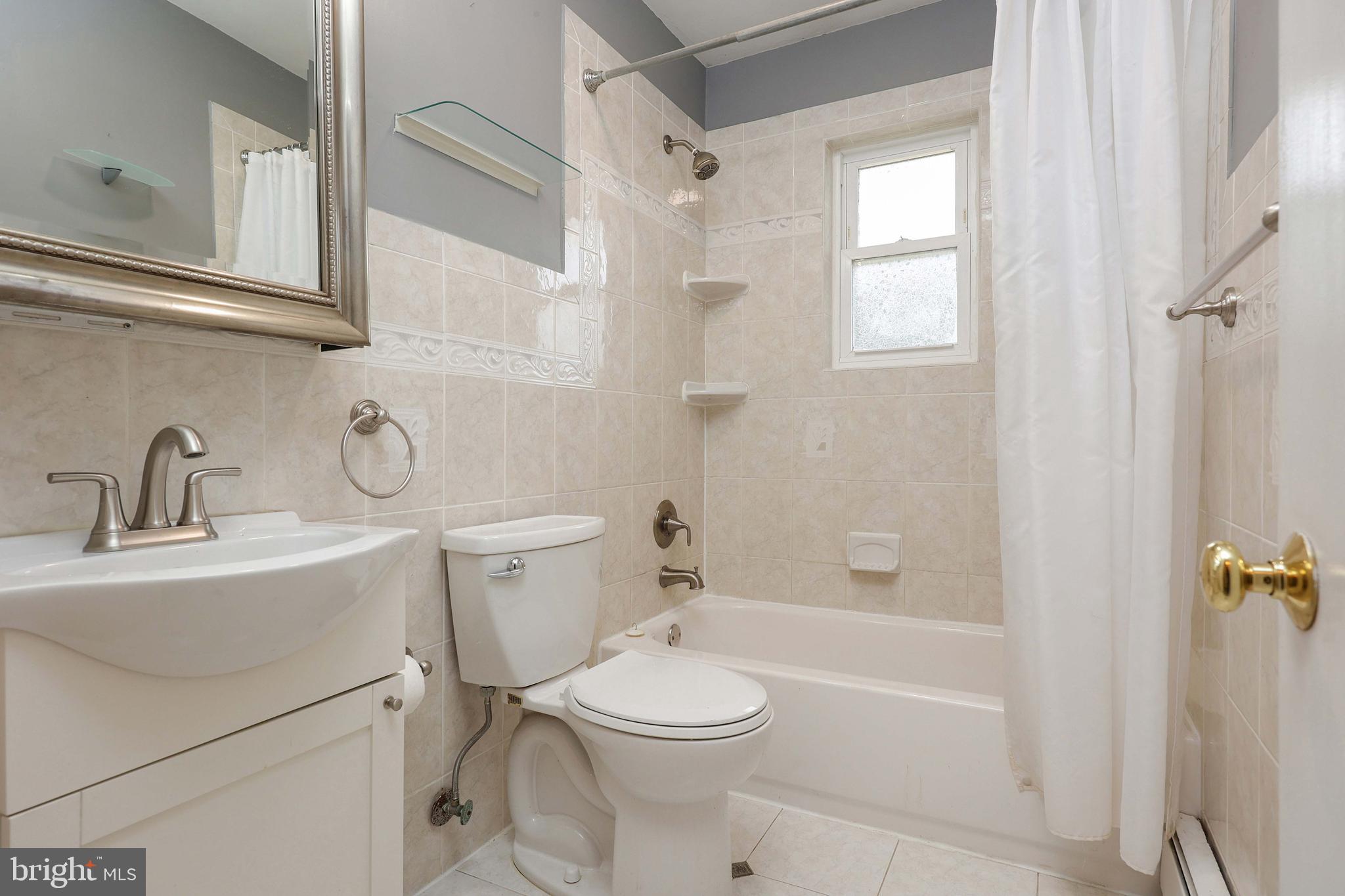105 Kentucky Avenue Hamilton, NJ 08619 - Photo 12 of 29 a bathroom with a sink toilet and shower